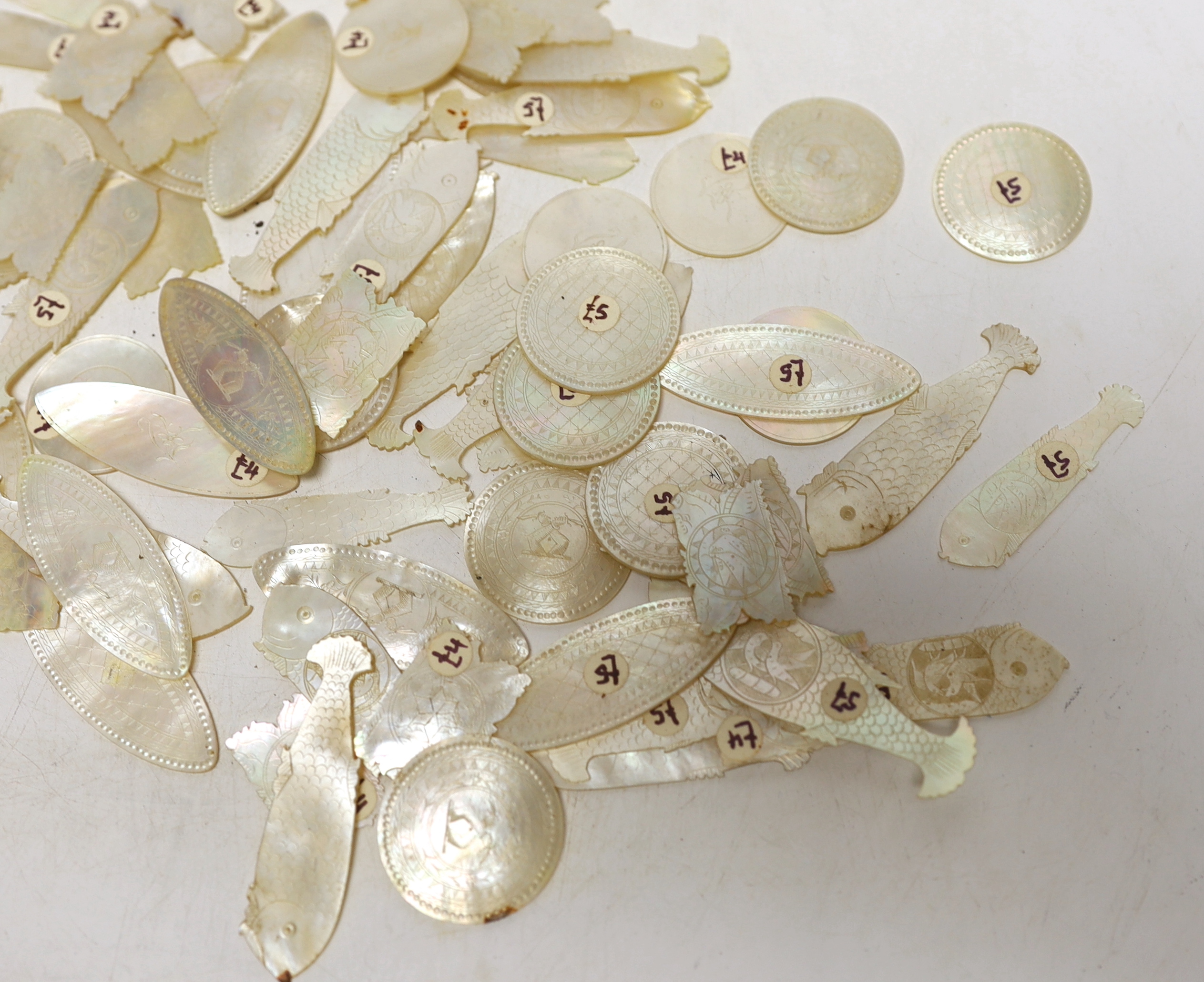 A collection of Chinese mother of pearl gaming counters